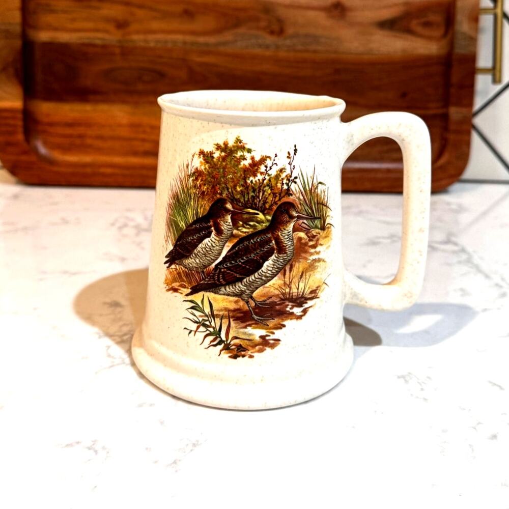 hyalyn art pottery pubware mug snipes in a marsh against a buff/brown speckled